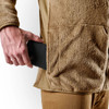 Model putting phone inside of the pocket of the jacket 
