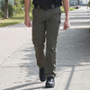 Man outside wearing the Rothco Men's Edge Pants in the color Ranger green 