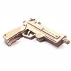 Caliber Rubber Band Hand Gun Puzzle lying flat on the side