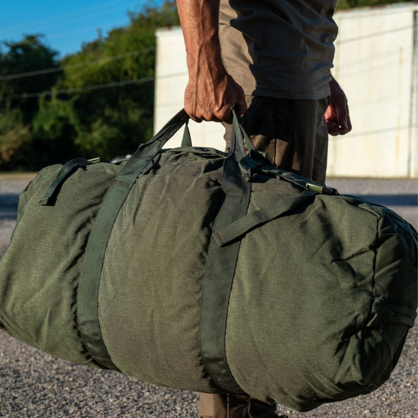 man outside holding the hands on the U.S. Issue Enhanced Nylon Duffle Bag man outside holding the hands on the U.S. Issue Enhanced Nylon Duffle Bag
