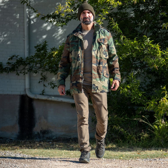 Man wearing the jacket walking Man wearing the jacket walking