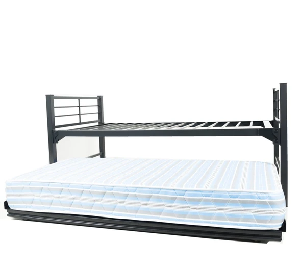 An institutional-grade black steel rolling trundle bed frame fitted with a mattress, rolling smoothly outward from beneath a high-clearance metal bed structure.