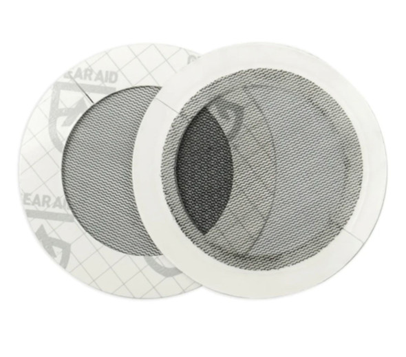 A pair of circular Tenacious Tape black mesh repair patches 