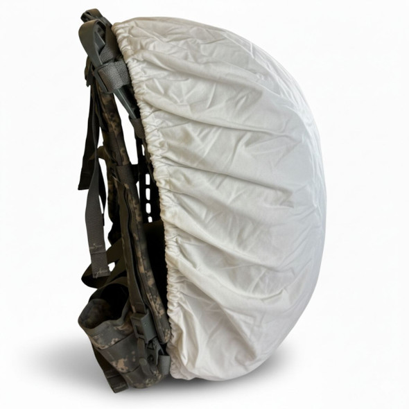 white backpack cover shown from a side angle on a rucksack