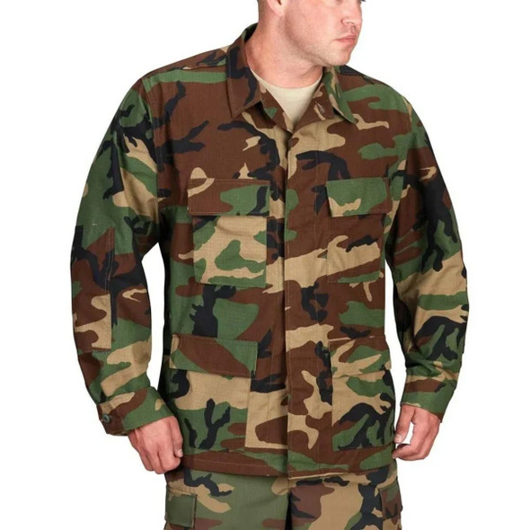 Model wearing the BDU jacket with his hands to the side 