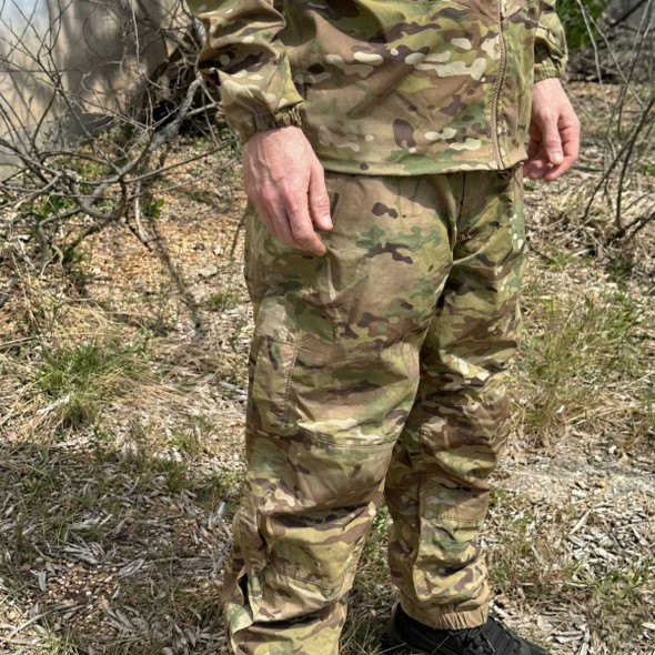 man wearing U.S. Army Issue OCP Level 6 Gore-Tex Pant  in the woods 