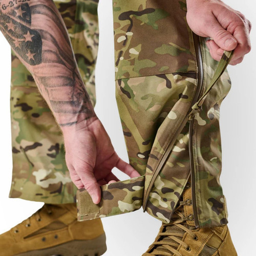 Close up of the zippered leg openings with hook-and-loop ankle adjustments to fit over boots