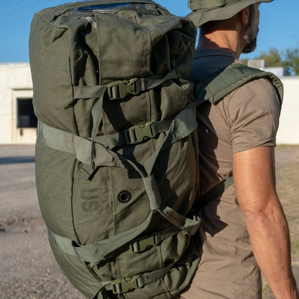 Man outside wearing the Nylon Duffle bag on his back