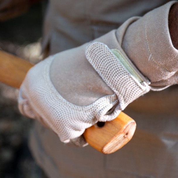 Model holding an axe and wearing the gloves