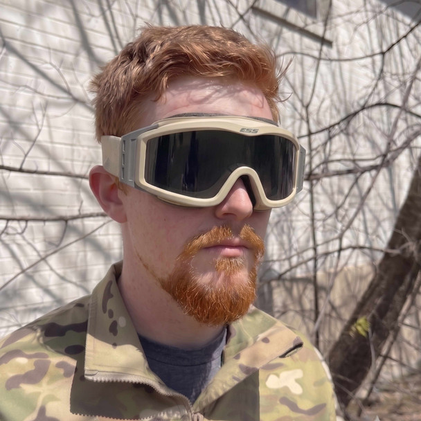 a man wearing the ESS Profile NVG Tan Military Issue Goggle