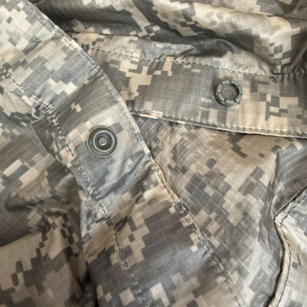 snaps of the U.S. Issue UCP Universal Camo Poncho 