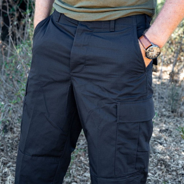 black bdu and on a man with his hands in is pocket