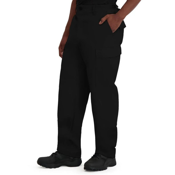 Side of the pant leg of the  BDU 100% Cotton Ripstop Pant Button Front in the color black  with left hand in pocket