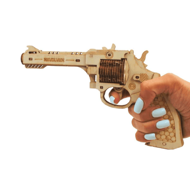 Hand holding the Revolver Wood Puzzle Gun