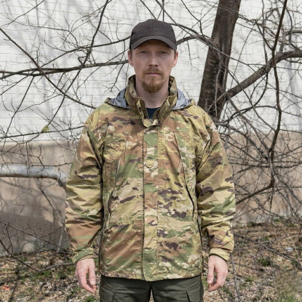 man wearing U.S. Army Issue OCP Level 6 ECWCS Jacket in the woods