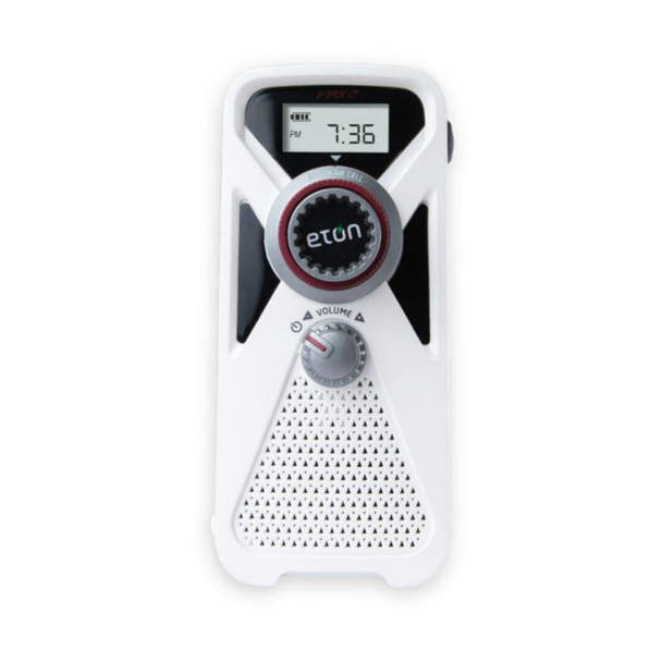 A compact white and red Eton American Red Cross FRX2 emergency radio showcasing its solar panel, top 3-LED flashlight, and digital tuner screen.