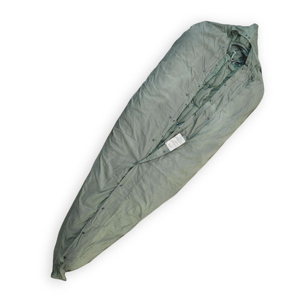 A vintage olive drab green cotton US military M-1945 mummy-style sleeping bag cover displayed at an angle on a white background, half-unsnapped