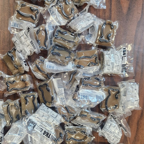 Pile of TK-4L Tourniquet - H&H on a table in packages