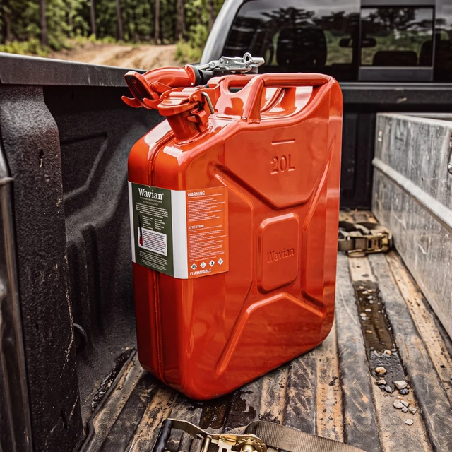 Red fuel can loaded in a pickup truck bed