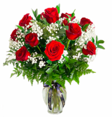12 Ecuadorian long-stemmed red roses inside a classic glass vase.