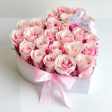 pink roses in a heart box.