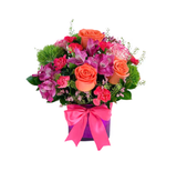 orange roses, pink alstroemerias, green dianthus in a pink cube.