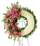 pink roses and white cushion funeral wreath.