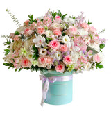 pink and white flowers in a tiffany color box.