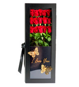 A black rectangular box with red roses and a gold i love you text on the lid.