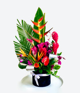 a tropical flowers arrangement in a black box