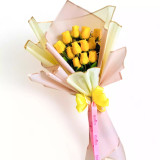 A bouquet of Yellow roses on a white backdrop.