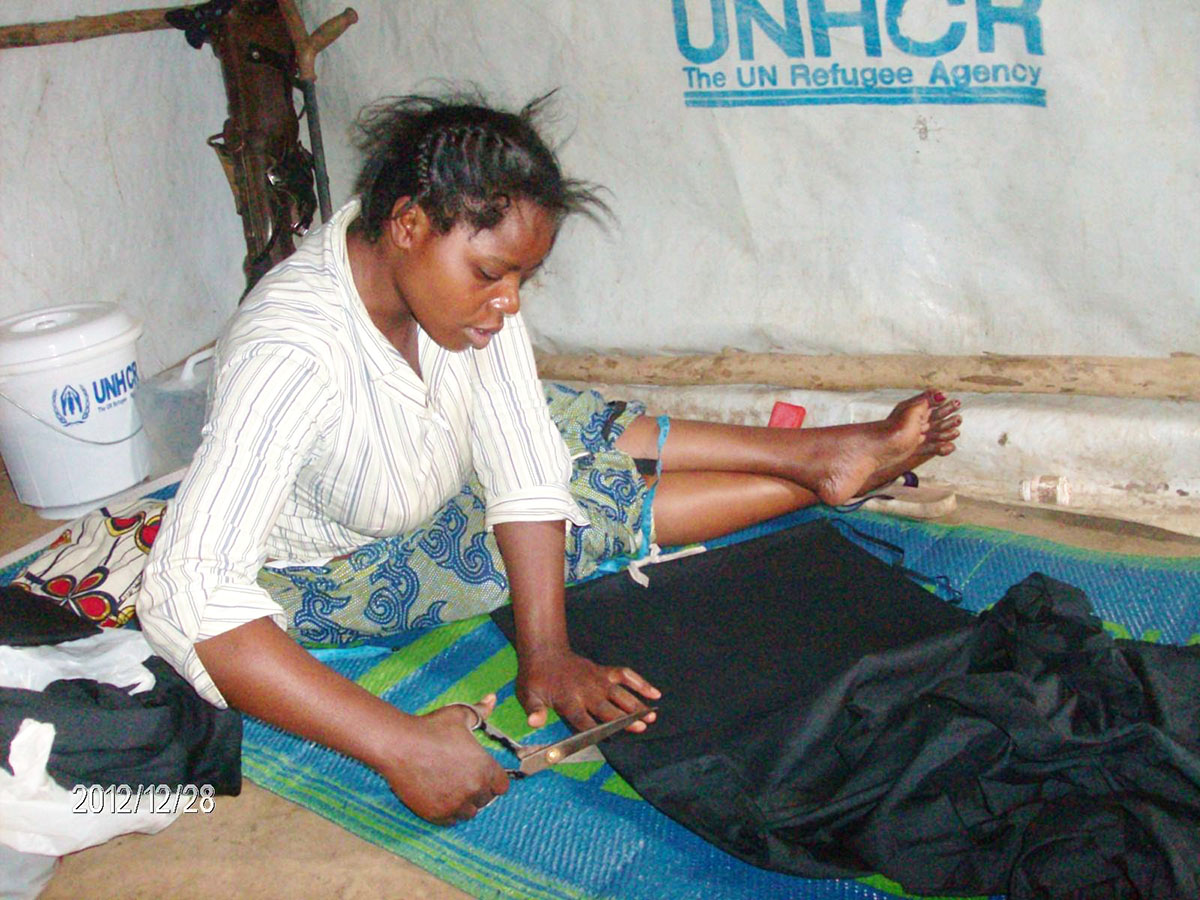 shona-mapendo-cutting-cloth-in-refugee-camp.jpg