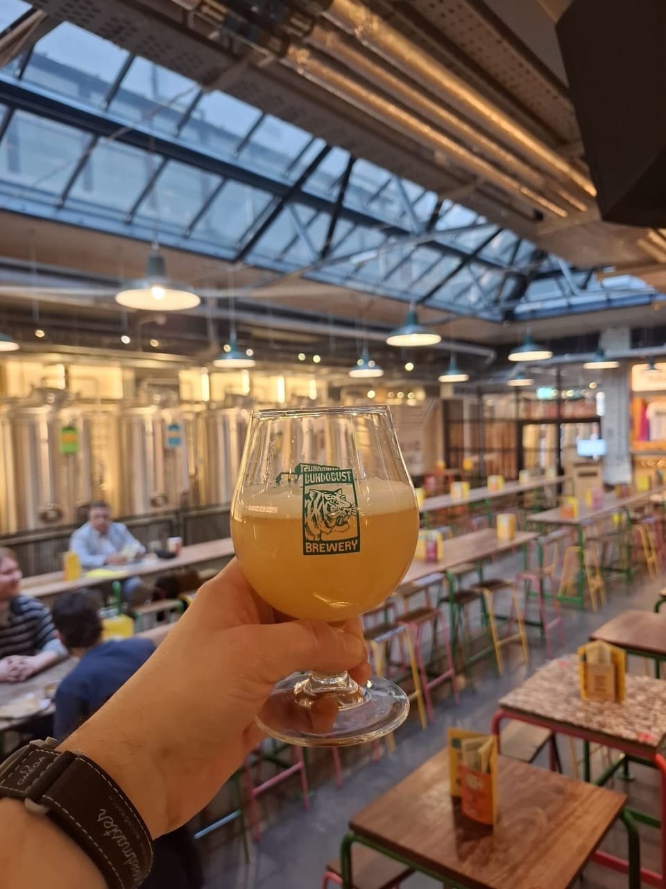 Drinking a beer and rasiing a glass at liverpoool trip