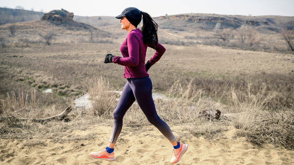 woman running in cold weather gear