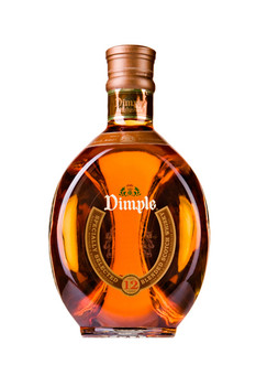 Dimple 12 Years Old blended Scotch whisky in its iconic triangular dimpled bottle