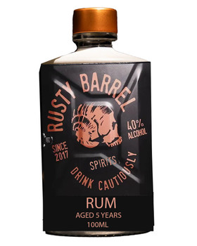100ml bottle of Rusty Barrel Rum, a small-batch aged rum with deep amber color