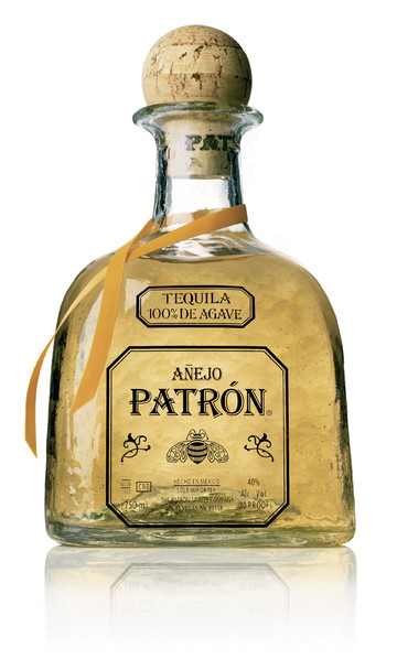 Bottle of Patrón Añejo aged tequila with warm amber color