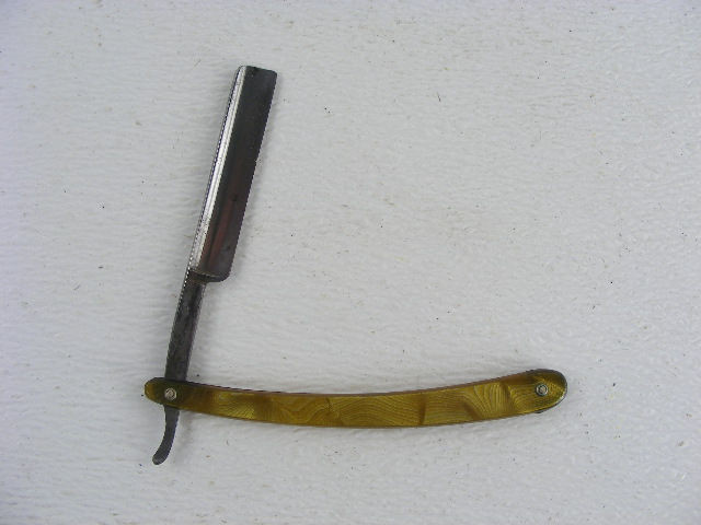 This antique straight razor is marked Chicago. - Antique Mystique