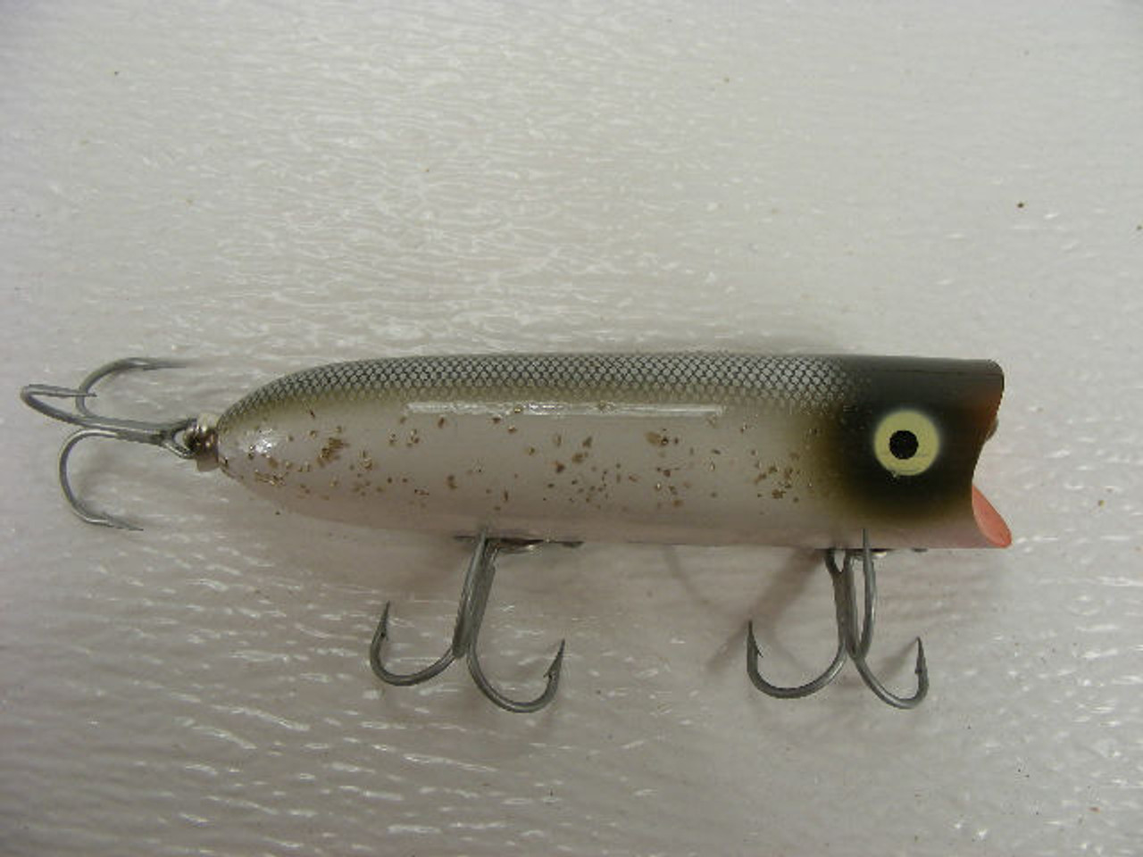 A 4 vintage plastic Heddon Lucky 13 fishing lure.