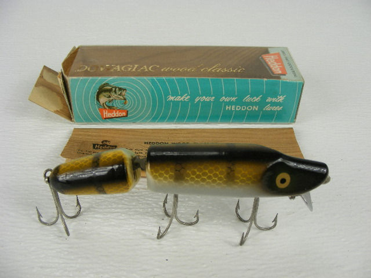 A 5" vintage Heddon Dowagiac Jointed Vamp wood lure #7300M with the  original box from the 1960s. - Antique Mystique