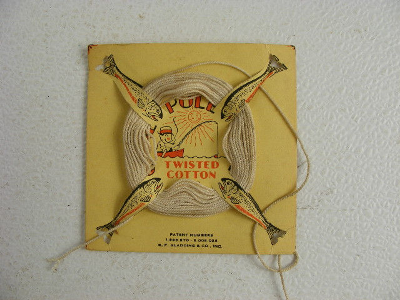 A neat vintage cane pole fishing line card designed with fish for
