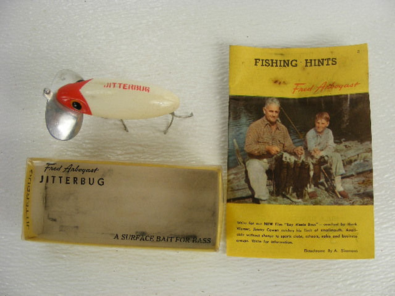 A vintage Fred Arbogast Jitterbug fishing lure with the original box and  fishing hints paper. - Antique Mystique