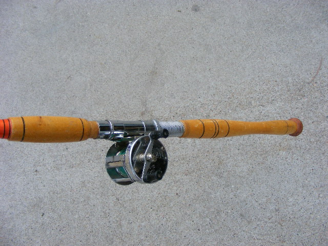 A vintage Great Lakes fishing reel and rod set probably for salmon fishing. Antique Mystique