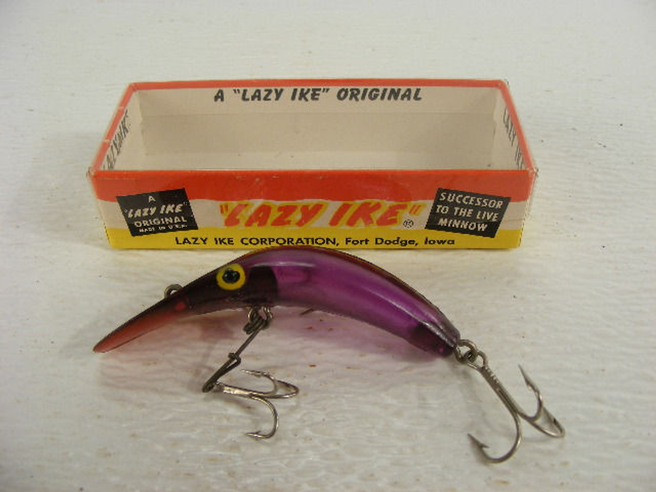 A vintage Lazy Ike fishing lure in the original box. - Antique Mystique