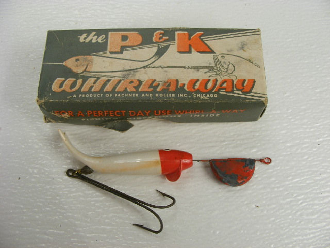 A vintage P & K Whirl-a-way fishing lure with the original box