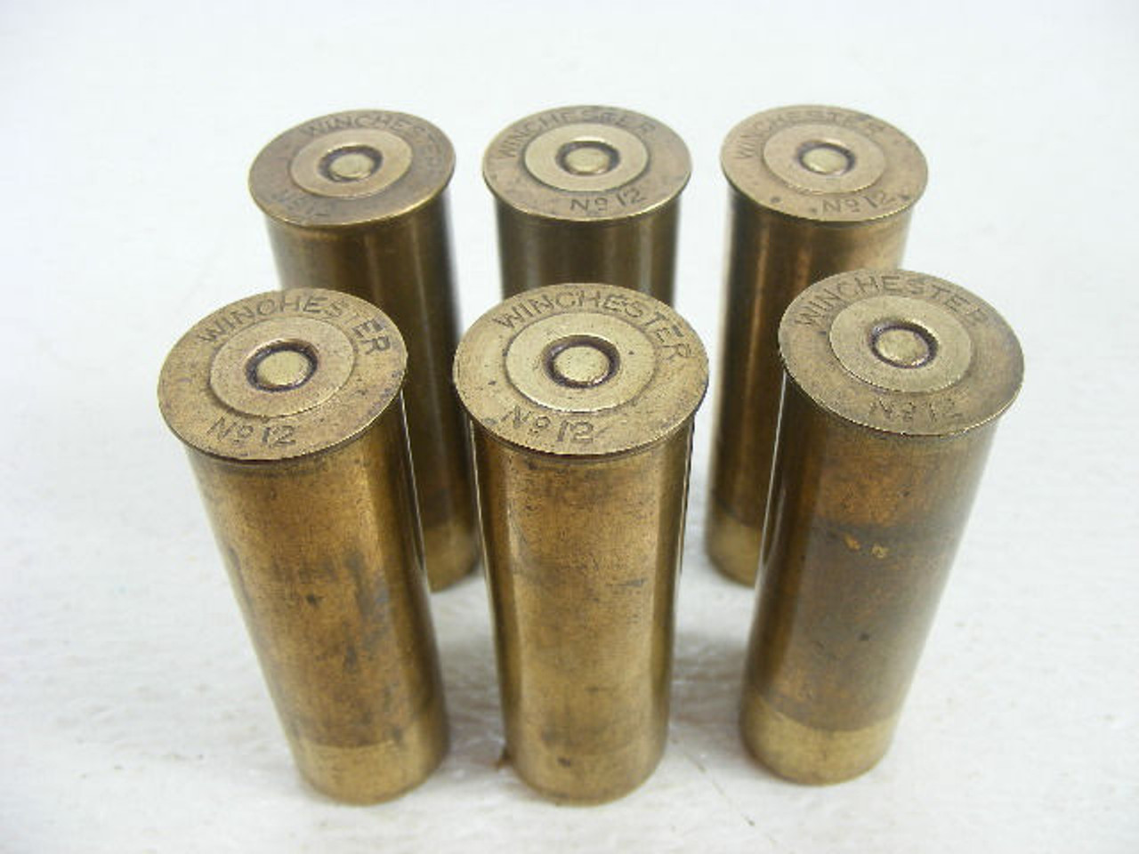 These are loaded antique Winchester brass shotgun shells in 12
