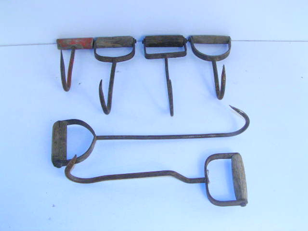 These are examples of the old hay hooks with wooden handles used on the  farm we have in stock.