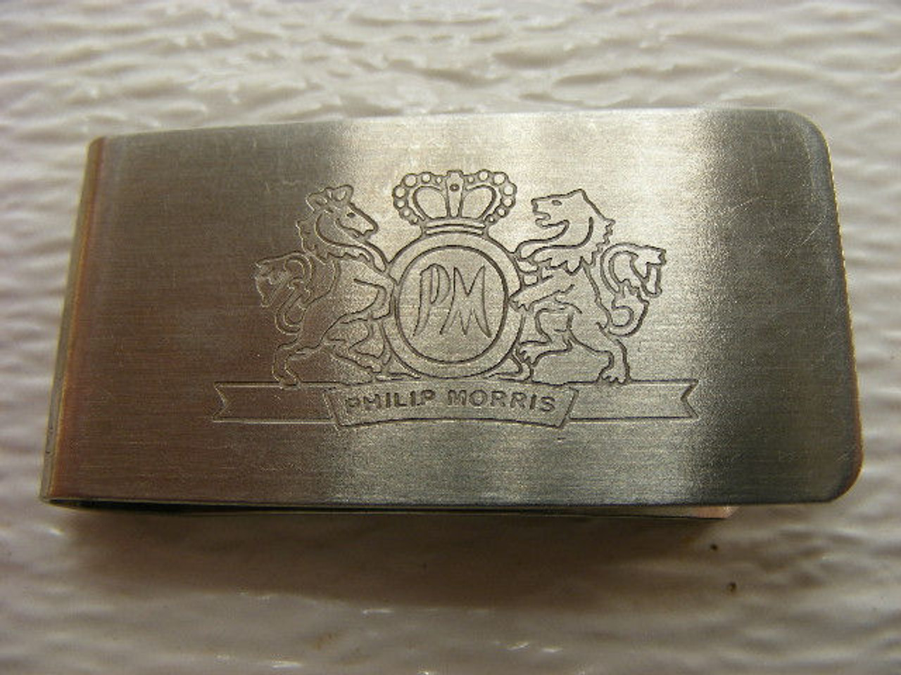 A vintage Philip Morris money clip made by Zippo.