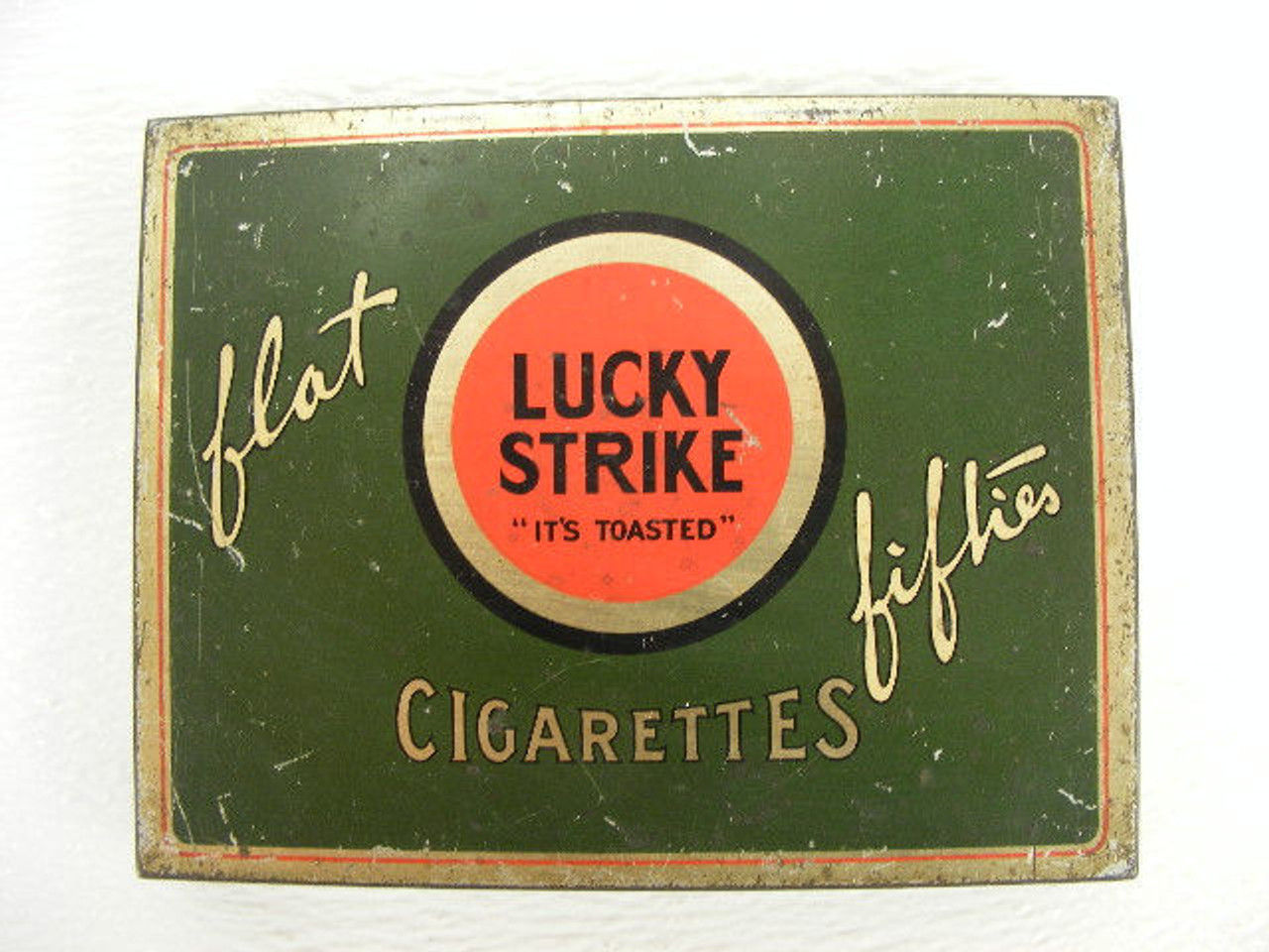 An old 1940s era Lucky Strike Flat Fifties cigarette tin with the indian  chief design interior. - Antique Mystique