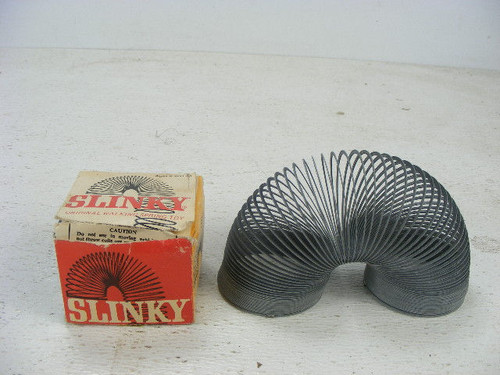 An original vintage Slinky in the original box.